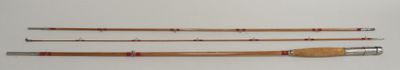 three different types of fishing rods are lined up on a white surface