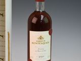 an image of a bottle of wine sitting next to a cardboard box