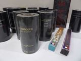 several cans of wine are sitting on a table next to a box of cigarettes