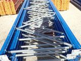 a person standing in front of a conveyor belt in a warehouse
