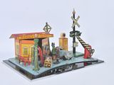 a small model of a train station on a book