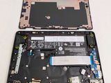 two laptops that have been completely disconnected from the motherboard