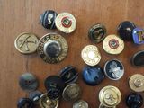 a lot of buttons that are on a table