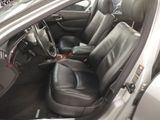 the interior of a car with black leather seats and a steering wheel