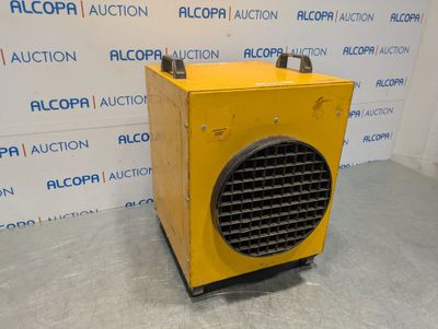 an image of a yellow heater sitting on top of a cement floor