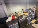 a room with many boxes and boxes on the floor