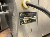a close up of a machine with a hose attached to it