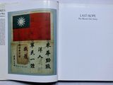 an open book with a picture of a flag on it