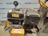 a machine that is sitting on the ground next to a wall