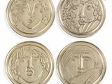four different types of coins with faces on them on a white background