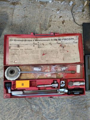 a tool set in a red case on the ground