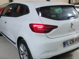 the rear end of a white car parked in a garage