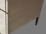 an image of a white chest of drawers on a gray background