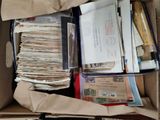 a box full of mail sitting on top of a table