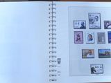 an open book with pictures on it on a table