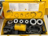 a yellow tool box with a bunch of tools inside of it