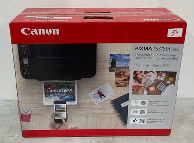 canon pixma 3525i printer in a box with a hand holding a phone
