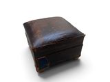 an old suitcase that is sitting on a white surface