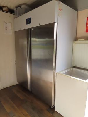 an image of a stainless steel refrigerator in a kitchen