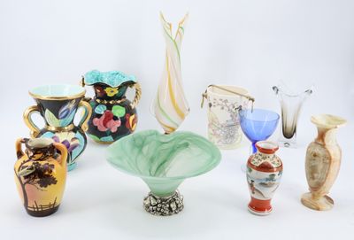 many different vases that are sitting on a table