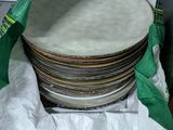 a lot of plates in a bag on the floor