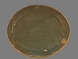 an image of a green plate on a gray background