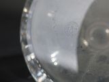 a close up view of a glass vase with a black background