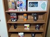 a wooden shelf with many different items on it