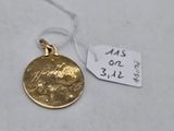 a small gold coin with a small tag on it