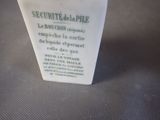 a small white vase with a black and white label on it
