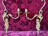 a purple couch with a gold candle holder on it