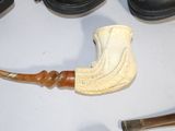 a picture of a pipe and a pair of shoes