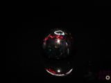 an image of a black oplite stone in the dark