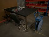 an image of a table and chairs in a warehouse