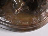 a bronze statue of a man riding a horse
