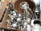 a box full of silver items sitting on the floor