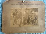 an old photo of a group of men posing for a picture