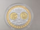 a close up of a coin in a plastic container on a table