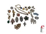 many different types of jewelry on a white surface