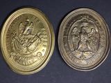 two gold coins with the image of a woman and a man on them