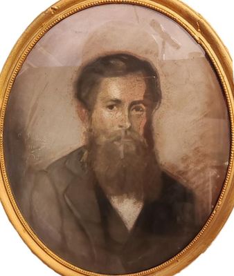 portrait d'un homme barbu dans un cadre en or