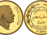 a close up of a gold coin with an image of a man on it