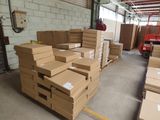 many boxes stacked on top of each other in a warehouse