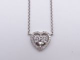 a diamond heart pendant on a chain on a white background