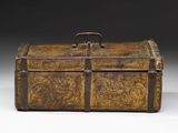 an old wooden box with a metal handle on a white surface