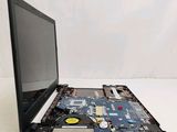 a laptop with a broken screen sitting on a table