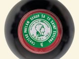 a black ball with a green and red label on it