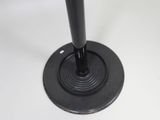 a close up of a metal object on a white surface