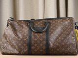 a brown louis vuitton bag sitting on a table