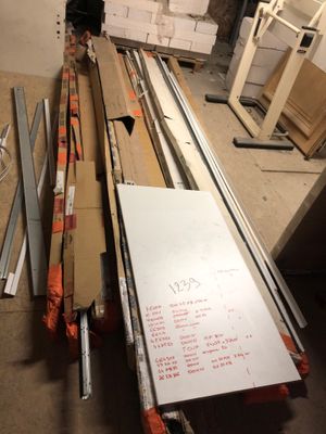 several pieces of wood are stacked on top of each other in a room